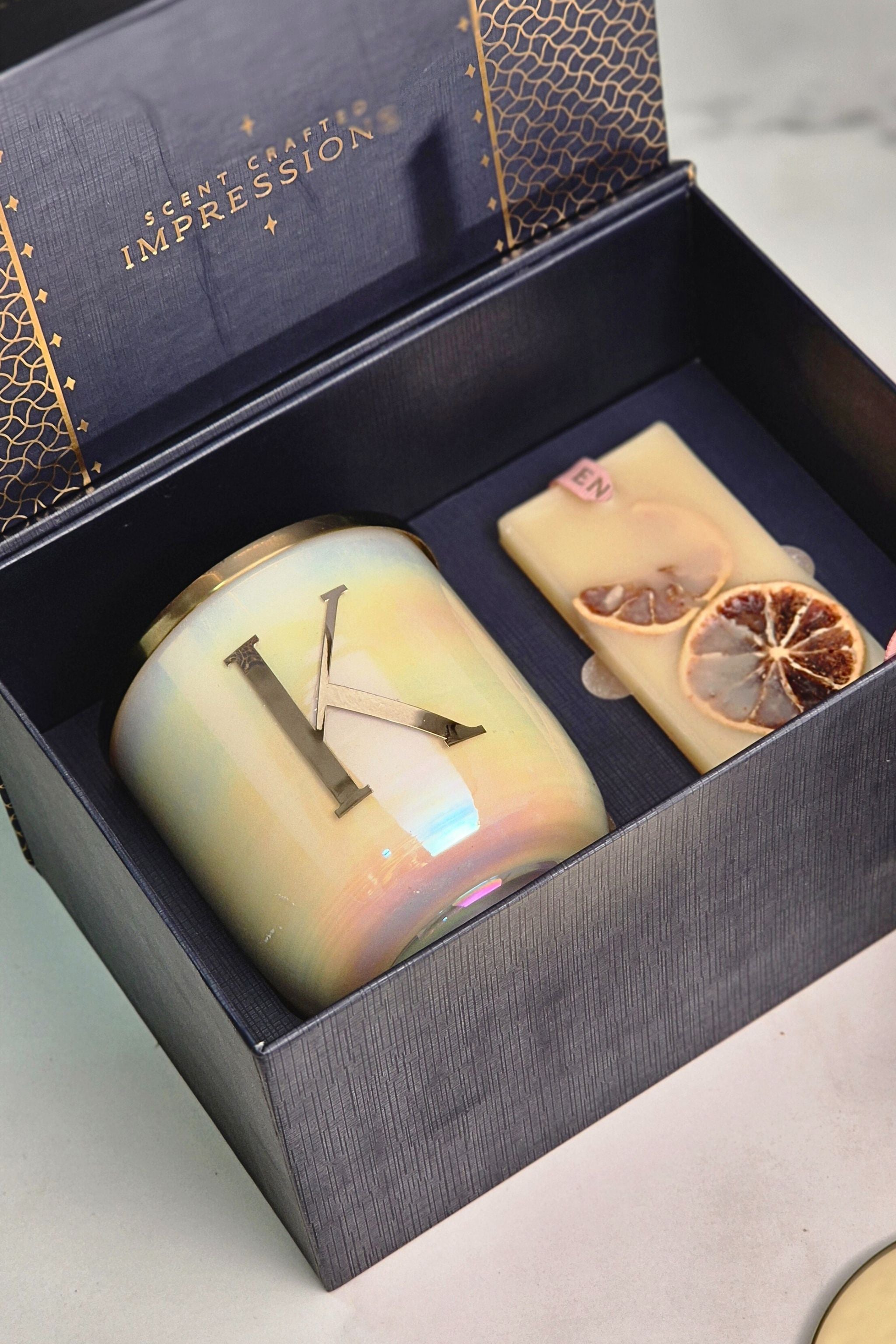 The Initial Candle + scented wax tablet